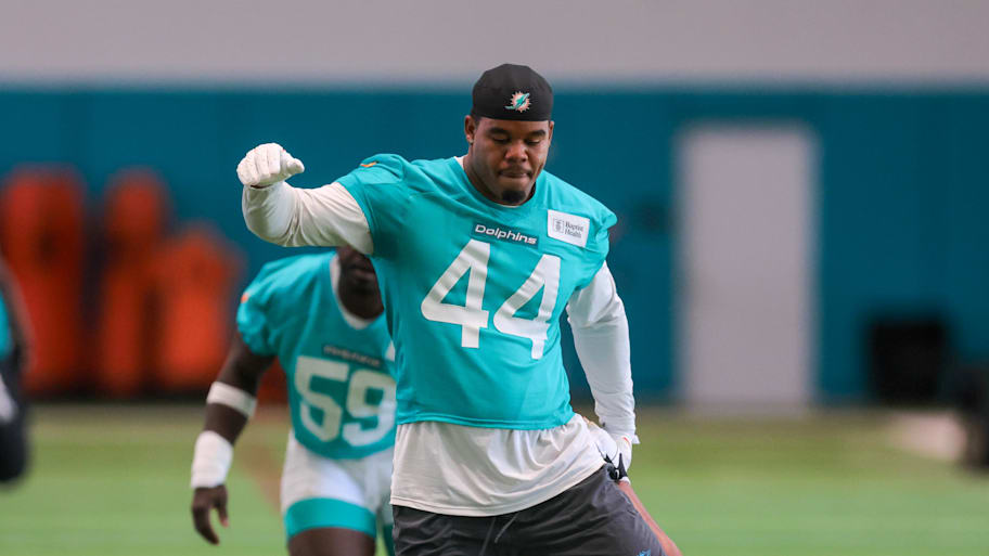 Jun 10, 2025; Miami, FL, USA; Miami Dolphins linebacker Chop Robinson (44) stretches during mandatory minicamp at Hard Rock Stadium. Mandatory Credit: Sam Navarro-Imagn Images | Sam Navarro-Imagn Images