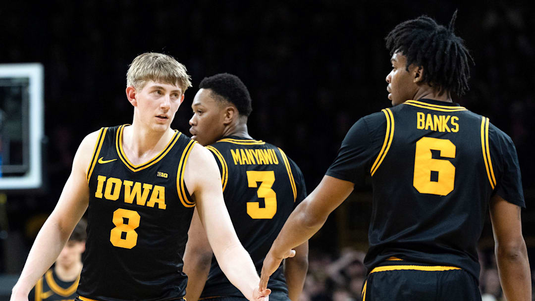 Iowa forward Cooper Koch (8) high-fives Iowa’s Tavion Banks (6) during a Big Ten basketball game against the Nebraska Cornhuskers Feb. 17, 2026 at Carver-Hawkeye Arena in Iowa City, Iowa.
