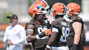 Cleveland Browns tight end David Njoku (85) shakes hands with tight end Harold Fannin Jr. (88) during minicamp at CrossCountry Mortgage Campus.