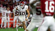 Oklahoma quarterback John Mateer carries the ball in the second half against the Alabama Crimson Tide.