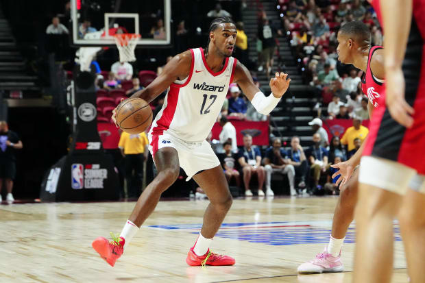 Washington Wizards forward Alex Sarr (12) dribbles against the Houston Rockets.