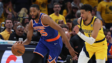 New York Knicks forward Mikal Bridges dribbles the ball defended by Indiana Pacers guard Tyrese Haliburton. Mandatory Credit: Trevor Ruszkowski-Imagn Images