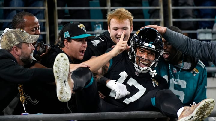 Jacksonville Jaguars tight end Evan Engram (17) celebrates a receiving touchdown with fans in the first half of a Week 13 NFL football game against the Cincinnati Bengals, Monday, Dec. 4, 2023, at EverBank Stadium in Jacksonville, Fla.