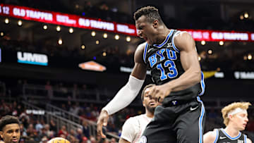 Mar 14, 2025; Kansas City, MO, USA; Brigham Young Cougars center Keba Keita (13) reacts after a dunk during the second half against the Houston Cougars at T-Mobile Center. Mandatory Credit: William Purnell-Imagn Images