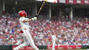 Jul 29, 2025; Cincinnati, Ohio, USA;  Cincinnati Reds outfielder Jake Fraley (27) watches his two-run home run against the Los Angeles Dodgers in the fourth inning at Great American Ball Park. Mandatory Credit: Aaron Doster-Imagn Images