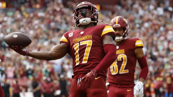 Oct 29, 2023; Landover, Maryland, USA; Washington Commanders wide receiver Terry McLaurin (17) celebrates after catching a touchdown pass against the Philadelphia Eagles during the first quarter at FedExField. Mandatory Credit: Geoff Burke-USA TODAY Sports