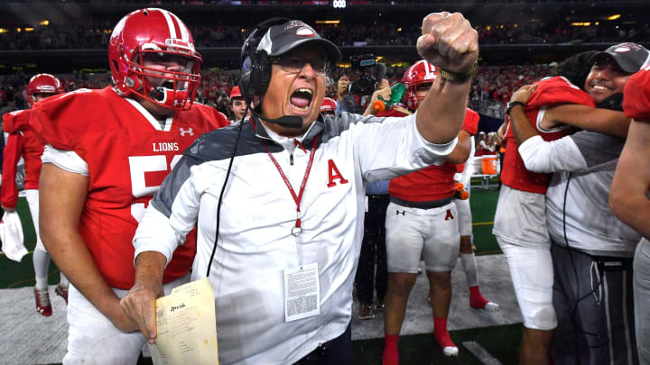 Albany coach Denney Faith cheers after 2022 UIL (Texas) 2A Division II state title at AT&T Stadium.