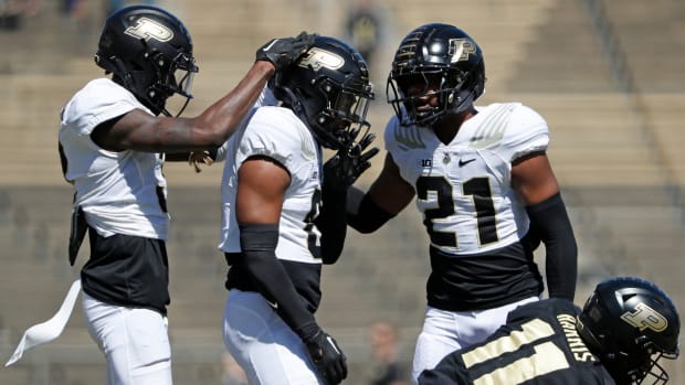 Purdue defensive back Derrick Rogers(3), Boilermakers defensive back Smiley Bradford (6) a