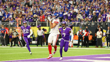 Jan 15, 2023; Minneapolis, Minnesota, USA; New York Giants wide receiver Isaiah Hodgins (18) makes a catch for a touchdown against the Minnesota Vikings during the first quarter of a wild card game at U.S. Bank Stadium. Mandatory Credit: Matt Krohn-USA TODAY Sports