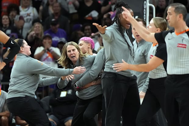 Minnesota Lynx head coach Cheryl Reeve is held back after being ejected. 