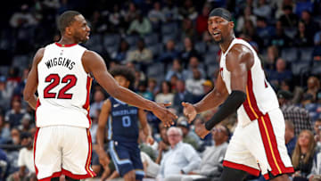 Oct 24, 2025; Memphis, Tennessee, USA; Miami Heat forward Andrew Wiggins (22) reacts with center Bam Adebayo (13) during the second quarter against the Memphis Grizzlies at FedExForum. Mandatory Credit: Petre Thomas-Imagn Images