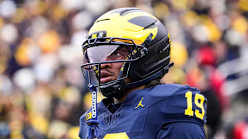 Michigan quarterback Bryce Underwood (19) looks on during warmup at Michigan Stadium in Ann Arbor on Saturday, Nov. 29, 2025.