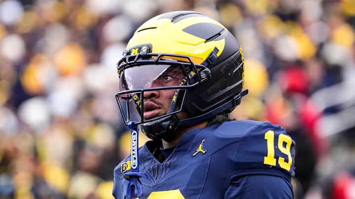 Michigan quarterback Bryce Underwood (19) looks on during warmup at Michigan Stadium in Ann Arbor on Saturday, Nov. 29, 2025.