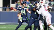 Nov 9, 2025; Seattle, Washington, USA;  Seattle Seahawks quarterback Sam Darnold (14) throws a pass during the first quarter against the Arizona Cardinals at Lumen Field. Mandatory Credit: Steven Bisig-Imagn Images