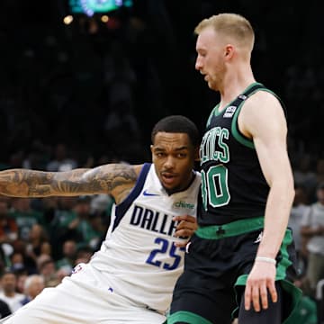 Jun 9, 2024; Boston, Massachusetts, USA; Dallas Mavericks forward P.J. Washington (25) controls the ball against Boston Celtics forward Sam Hauser (30) during the first quarter in game two of the 2024 NBA Finals at TD Garden. Mandatory Credit: Peter Casey-Imagn Images