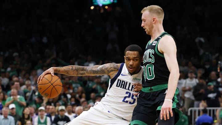 Jun 9, 2024; Boston, Massachusetts, USA; Dallas Mavericks forward P.J. Washington (25) controls the ball against Boston Celtics forward Sam Hauser (30) during the first quarter in game two of the 2024 NBA Finals at TD Garden. Mandatory Credit: Peter Casey-Imagn Images