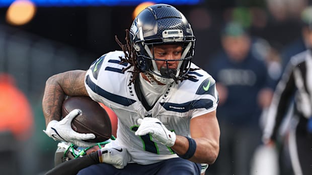 Seattle Seahawks wide receiver Jaxon Smith-Njigba (11) is tackled by New York Jets cornerback Michael Carter II (30)