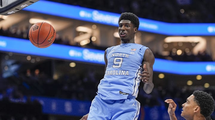 Mar 14, 2025; Charlotte, NC, USA; North Carolina Tar Heels guard Drake Powell (9) with a dunk against the Duke Blue Devils during the first half at Spectrum Center. Mandatory Credit: Jim Dedmon-Imagn Images