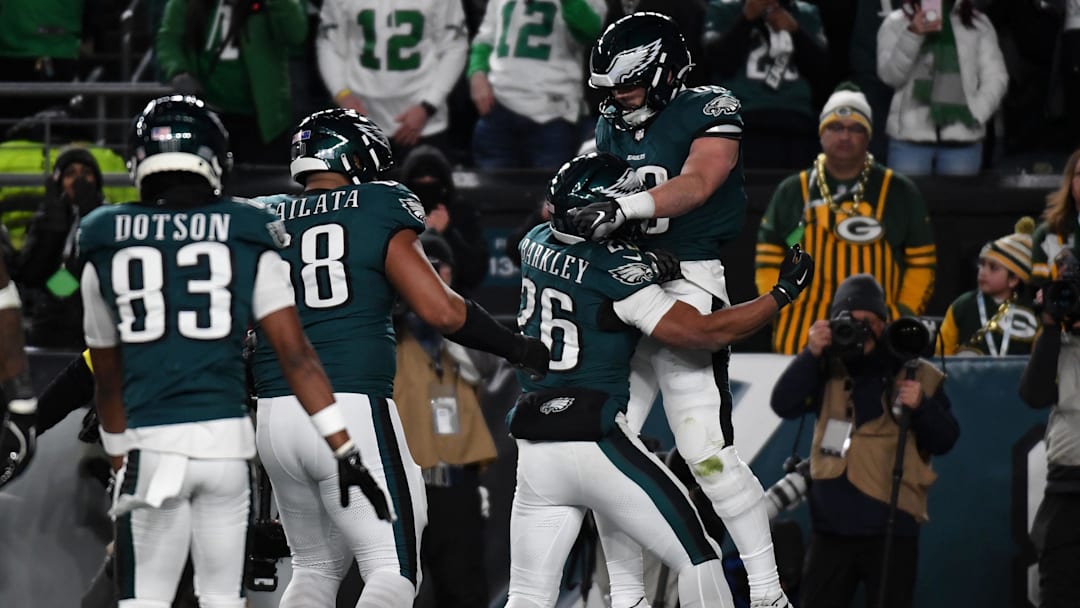 Jan 12, 2025; Philadelphia, Pennsylvania, USA; Philadelphia Eagles tight end Dallas Goedert (88) reacts after a touchdown against the Green Bay Packers cornerback Carrington Valentine (24) during the second half in an NFC wild card game at Lincoln Financial Field. Mandatory Credit: Eric Hartline-Imagn Images