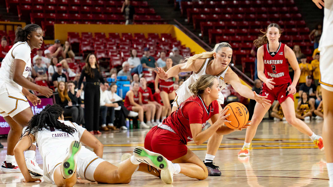 Arizona State Sun Devils Marley Washenitz (11) attempts to block a pass from Eastern Washington Eagles Emily McElmurry (23) during a game at Desert Financial Arena in Tempe, on Nov. 8, 2025.