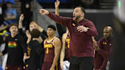 Feb 18, 2025; Los Angeles, California, USA; Minnesota Golden Gophers head coach Ben Johnson (center) as the team bench reacts to a 3-point basket during the second half against the UCLA Bruins at Pauley Pavilion presented by Wescom. Mandatory Credit: Robert Hanashiro-Imagn Images
