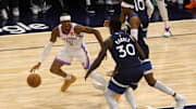 Oklahoma City Thunder guard Shai Gilgeous-Alexander dribbles against Julius Randle during the 2025 NBA Playoffs