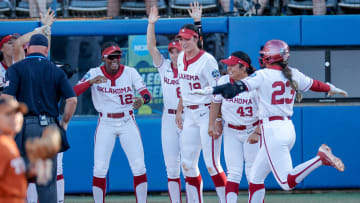 Oklahoma City, Okla., June 5, 2024 -- Oklahoma second baseman Tiare Jennings (23) hits a home run in the first inning of the first game of the Women’s College World Series softball championship series between the Oklahoma Sooners and the Texas Longhorns at Devon Park in Oklahoma City on Wednesday.