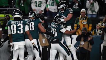 Jan 12, 2025; Philadelphia, Pennsylvania, USA; Philadelphia Eagles tight end Dallas Goedert (88) reacts after a touchdown against the Green Bay Packers cornerback Carrington Valentine (24) during the second half in an NFC wild card game at Lincoln Financial Field. Mandatory Credit: Eric Hartline-Imagn Images