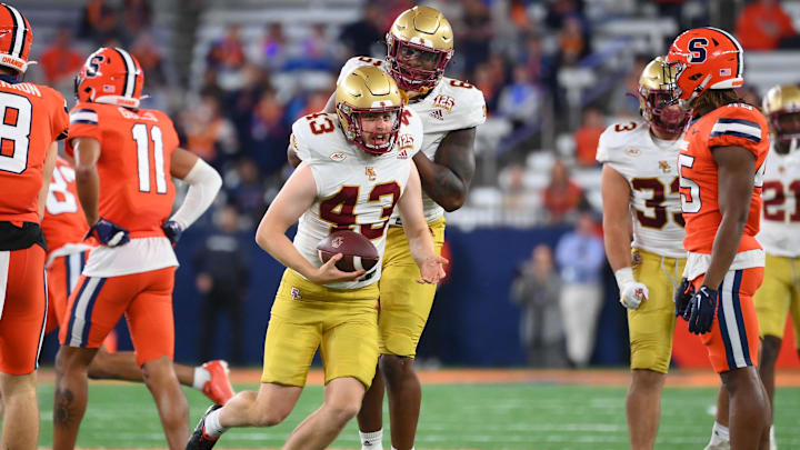 Nov 3, 2023; Syracuse, New York, USA; Boston College Eagles punter Sam Candotti (43) celebrates his fake punt run for a first down against the Syracuse Orange during the second half at the JMA Wireless Dome. Mandatory Credit: Rich Barnes-Imagn Images