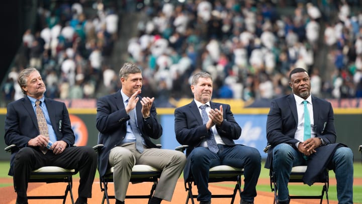 Seattle Mariners former players Jamie Moyer and Dan Wilson and Edgar Martinez and Ken Griffey Jr. react during the induction ceremonies for Mariners former player Ichiro Suzuki in to the Mariner Hall of Fame before a game between the Seattle Mariners and the Cleveland Guardians at T-Mobile Park in 2022.