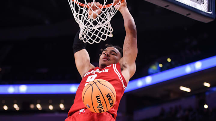 Dec 14, 2024; Indianapolis, Indiana, USA;  Wisconsin Badgers guard John Tonje (9) dunks the ball against the Butler Bulldogs during the second half at Gainbridge Fieldhouse. Mandatory Credit: Robert Goddin-Imagn Images