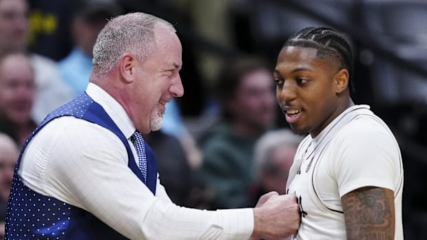 Texas A&M Aggies head coach Buzz Williams and guard Wade Taylor IV