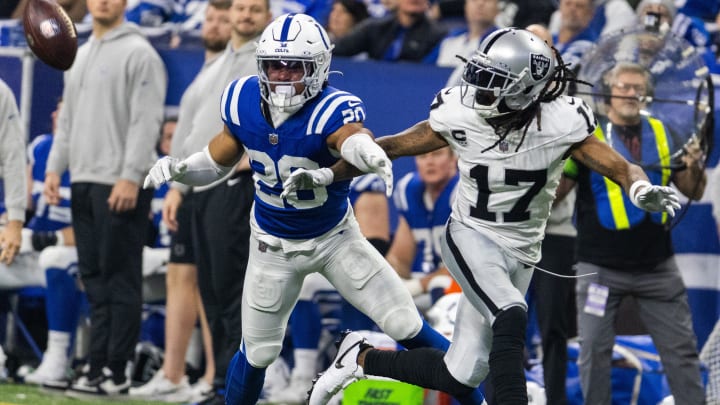 Dec 31, 2023; Indianapolis, Indiana, USA; Indianapolis Colts safety Nick Cross (20) defends Las Vegas Raiders wide receiver Davante Adams (17)  in the first half at Lucas Oil Stadium. Mandatory Credit: Trevor Ruszkowski-USA TODAY Sports