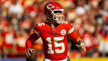 Nov 10, 2024; Kansas City, Missouri, USA; Kansas City Chiefs quarterback Patrick Mahomes (15) drops back to pass during the first half against the Denver Broncos at GEHA Field at Arrowhead Stadium. Mandatory Credit: Jay Biggerstaff-Imagn Images