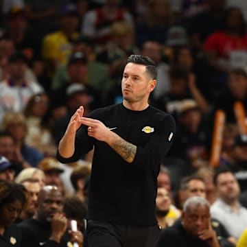 Oct 28, 2024; Phoenix, Arizona, USA; Los Angeles Lakers head coach JJ Redick with forward LeBron James (23) against the Phoenix Suns at Footprint Center. Mandatory Credit: Mark J. Rebilas-Imagn Images