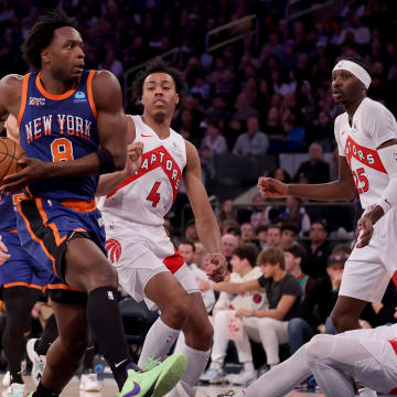 Jan 20, 2024; New York, New York, USA; New York Knicks forward OG Anunoby (8) drives to the basket against Toronto Raptors forwards Scottie Barnes (4) and Chris Boucher (25) and guard Gradey Dick (1) during the second quarter at Madison Square Garden. Mandatory Credit: Brad Penner-USA TODAY Sports