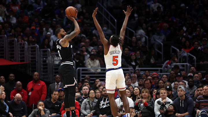 Los Angeles Clippers forward Marcus Morris Sr. (8) shoots a three point basket against New York Knicks guard Immanuel Quickley (5) at Crypto.com Arena.