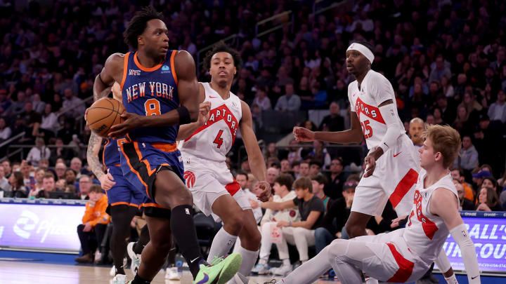 Jan 20, 2024; New York, New York, USA; New York Knicks forward OG Anunoby (8) drives to the basket against Toronto Raptors forwards Scottie Barnes (4) and Chris Boucher (25) and guard Gradey Dick (1) during the second quarter at Madison Square Garden. Mandatory Credit: Brad Penner-USA TODAY Sports