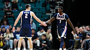 Nov 24, 2025; Las Vegas, Nevada, USA; Gonzaga Bulldogs guard Tyon Grant-Foster (7) and forward Steele Venters (2) react during the first half against the Alabama Crimson Tide in a 2025 Players Era Festival group play game at MGM Grand Garden Arena.
