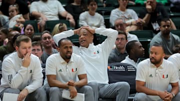 Jan 18, 2025; Coral Gables, Florida, USA; Miami Hurricanes interim head coach Bill Courtney reacts from the bench against the Southern Methodist Mustangs during the first half at Watsco Center. Mandatory Credit: Sam Navarro-Imagn Images