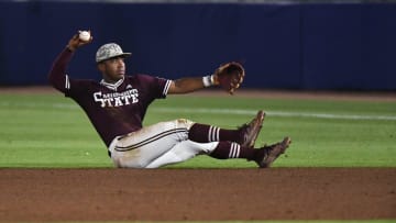 May 24 2024; Hoover, AL, USA; Mississippi State second baseman Amani Larry throws to first for an out against Tennessee at the Hoover Met during the SEC Tournament.