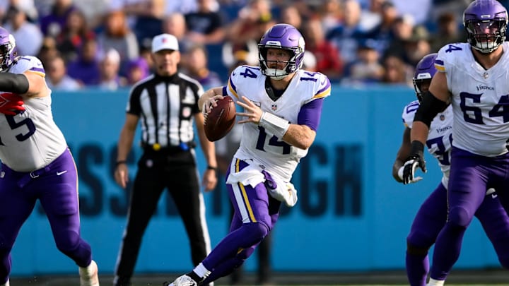 Minnesota Vikings quarterback Sam Darnold scrambles against the Tennessee Titans
