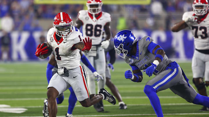 Georgia Bulldogs running back Trevor Etienne and Kentucky Wildcats defensive back Kristian Story at Kroger Field. 