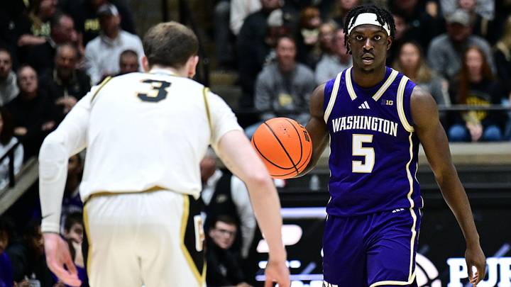 Jan 7, 2026; West Lafayette, Indiana, USA; Washington Huskies guard Zoom Diallo (5) dribbles down court in front of Purdue Boilermakers guard Braden Smith (3) during the first half at Mackey Arena. Mandatory Credit: Marc Lebryk-Imagn Images
