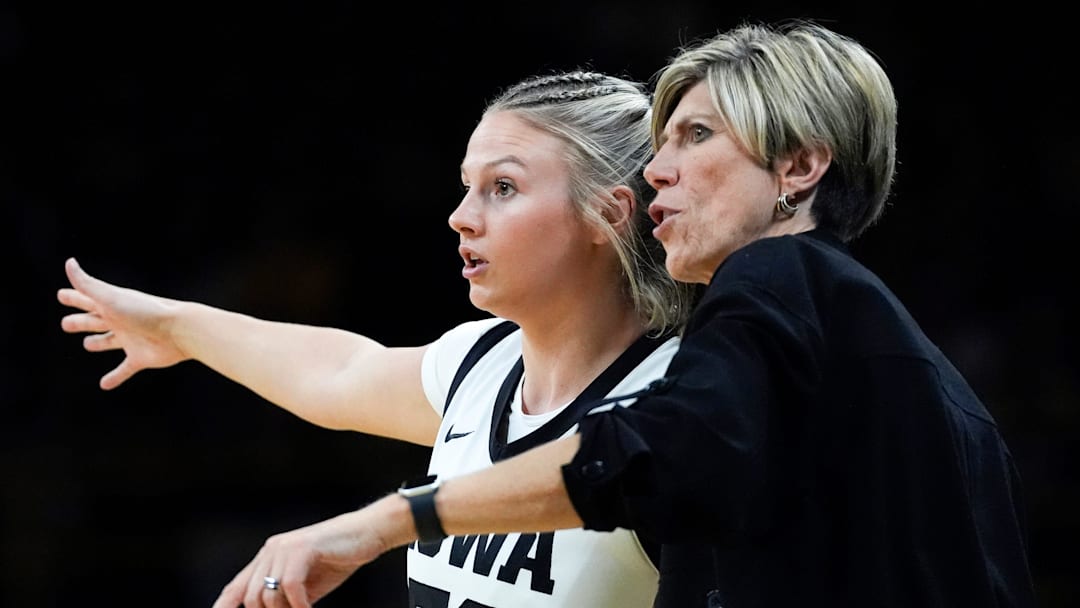 Iowa guard Callie Levin (32) talks to Iowa head coach Jan Jensen Oct. 30, 2025 during an exhibition game against the Ashland Eagles at Carver-Hawkeye Arena in Iowa City, Iowa. Iowa guard Callie Levin (32) talks to Iowa head coach Jan Jensen Oct. 30, 2025 during an exhibition game against the Ashland Eagles at Carver-Hawkeye Arena in Iowa City, Iowa.