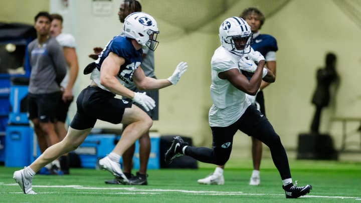 Kody Epps catches a pass from Jake Retzlaff at Fall camp