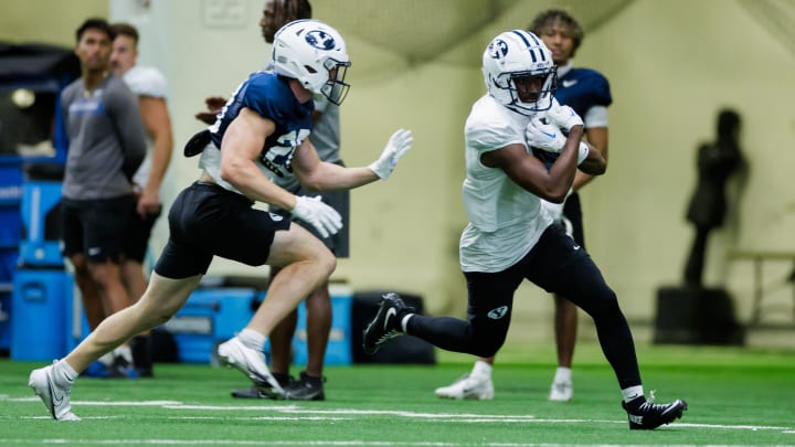 Kody Epps catches a pass from Jake Retzlaff at Fall camp