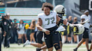 Fighting Ducks offensive lineman Iapani Laloulu celebrates as the Fighting Ducks face off against Mighty Oregon in the Oregon Ducks spring game on April 26, 2025, at Autzen Stadium in Eugene.