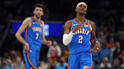 Oklahoma City Thunder' Shai Gilgeous-Alexander and Chet Holmgren look on against the Memphis Grizzlies during the 2025 NBA Playoffs.