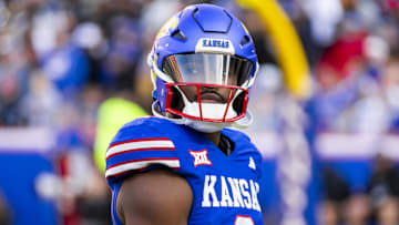 Nov 23, 2024; Kansas City, Missouri, USA;  Kansas quarterback Jalon Daniels (6) gets set to take the field during the 1st quarter between the Kansas Jayhawks and the Colorado Buffaloes at GEHA Field at Arrowhead Stadium. Mandatory Credit: Nick Tre. Smith-Imagn Images